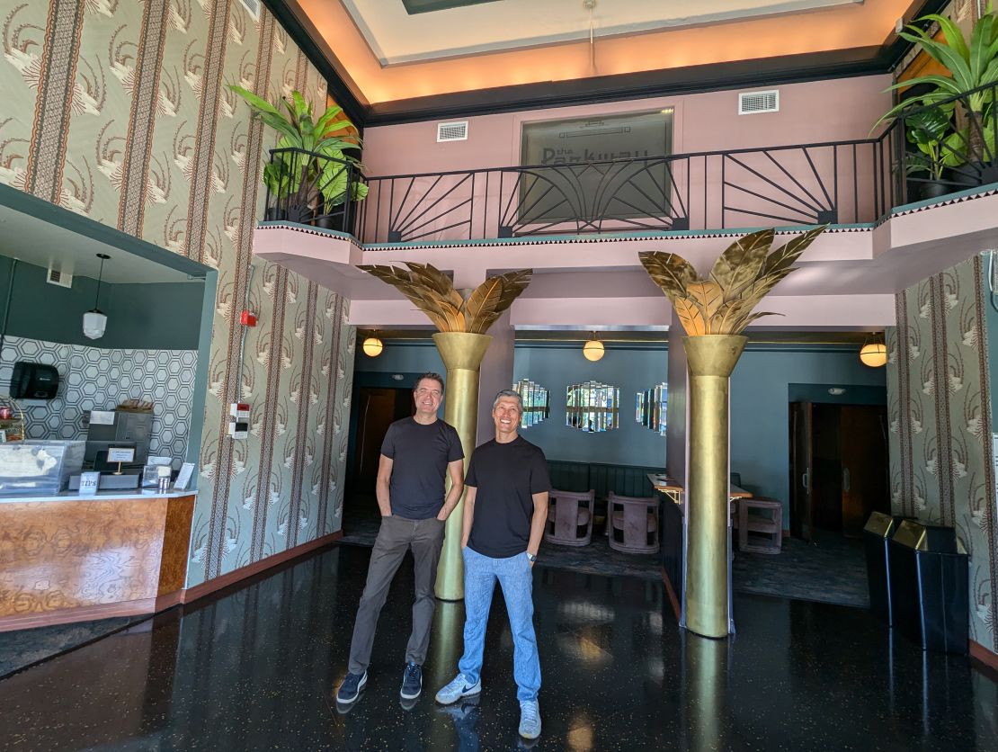 Parkway Theater owners Ward Johnson (left) and Eddie Landenberger in the theater lobby in Minneapolis on July 8.